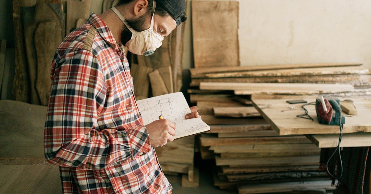Small manufacturing shop floor with computer screen showing MRP software dashboard