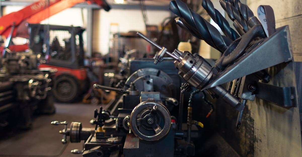 Machine shop floor with CNC lathes and milling machines running production jobs