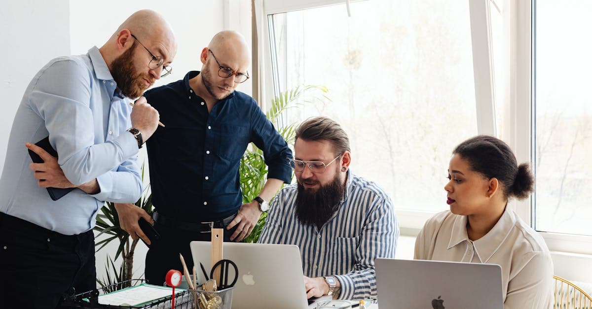 Manufacturing CFO comparing one-time license and SaaS pricing models on a financial analysis spreadsheet