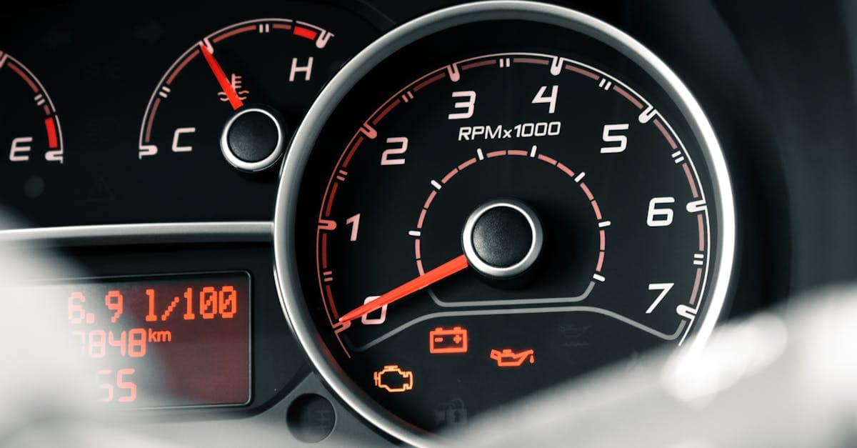 Maintenance technician using vibration analysis equipment on a CNC machine with predictive analytics displayed on tablet