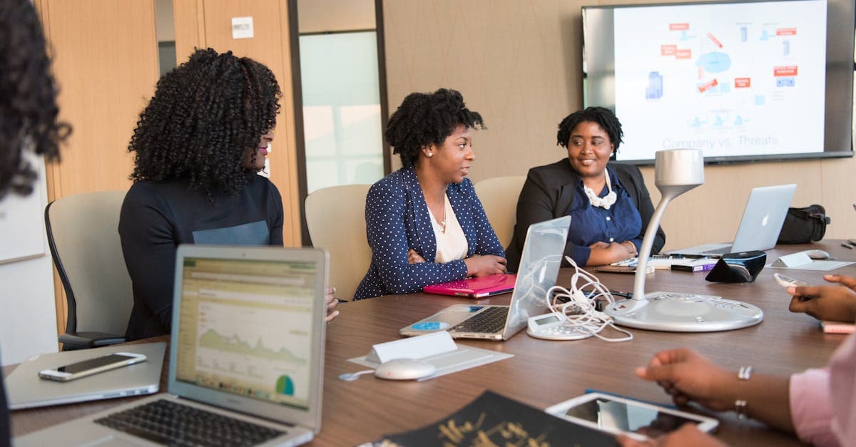 Manufacturing procurement team drafting a scheduling software RFP document with evaluation criteria checklist