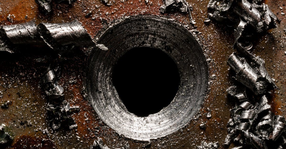 Manufacturing quality control station with scrap analysis data displayed on monitors