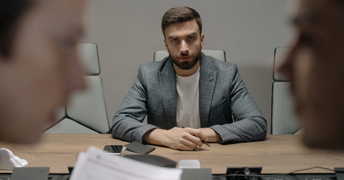 Frustrated manufacturing scheduler looking at outdated whiteboard scheduling system alongside modern software on a screen