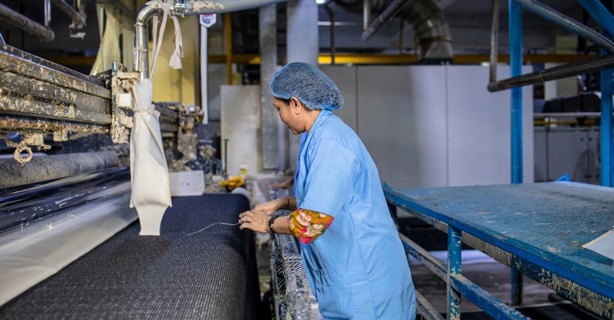 Standard work document posted at a manufacturing workstation showing sequence, timing, and WIP standards