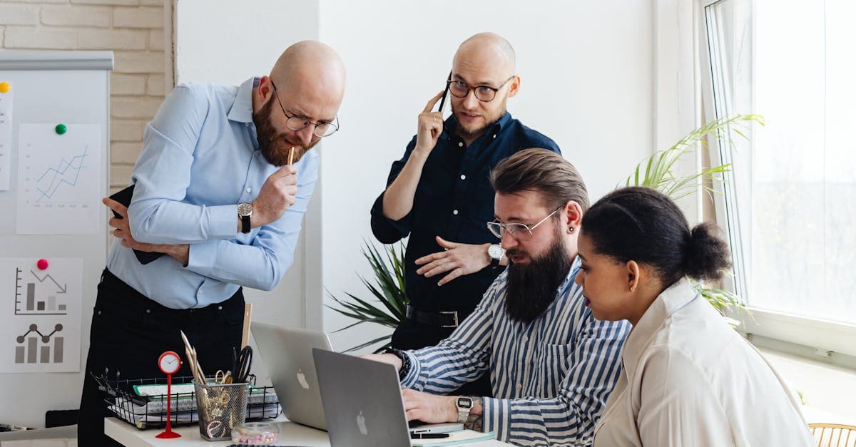 Frustrated manufacturing scheduler looking at outdated whiteboard scheduling system alongside modern software on a screen