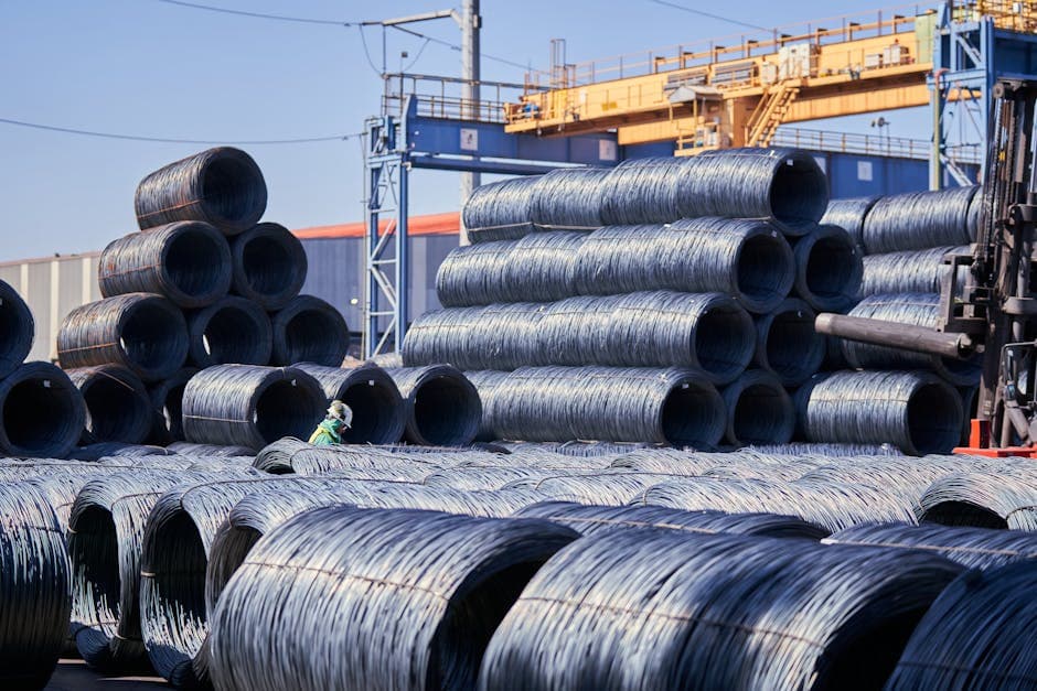 Industrial warehouse with steel coils and raw materials storage representing supply chain management