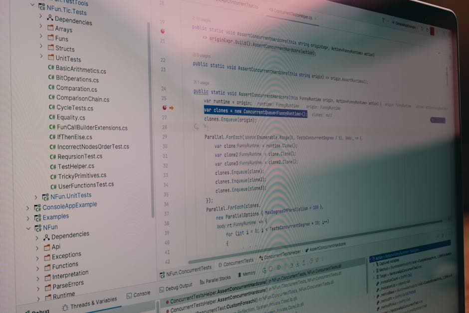 Software development environment on a laptop screen representing a manufacturing software pilot test